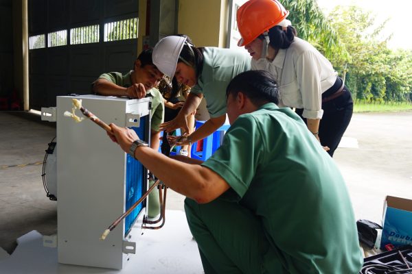 The teachers were connecting the copper pipes with indoor unit