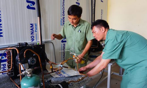 The teachers were connecting copper pipes with the outdoor unit