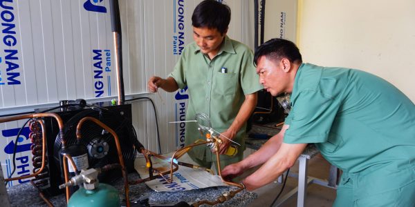 The teachers were connecting copper pipes with the outdoor unit