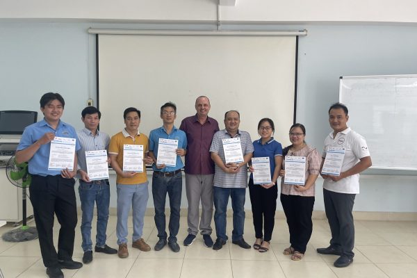 Group photo of participants with certificates on the completion of the training.