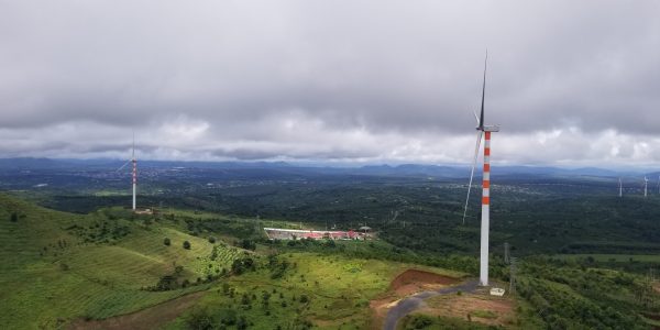 Panoramic view of the turbines at wind farm from the top of a Nacelle.