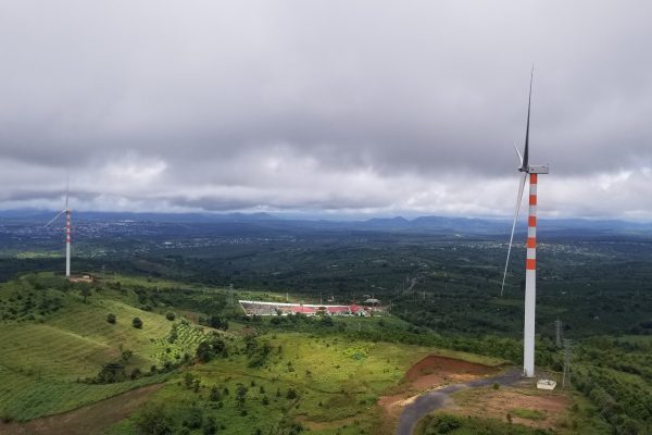 Panoramic view of the turbines at wind farm from the top of a Nacelle.