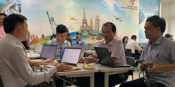 Participants engaging in discussions and group work.