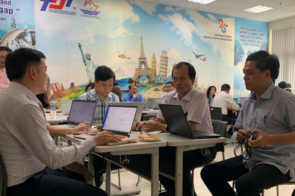 Participants engaging in discussions and group work.