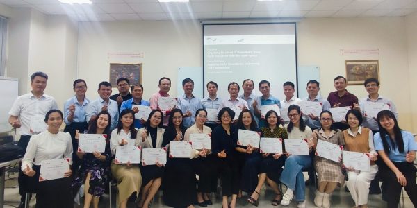 Participants receiving certificates of completion for the training workshop.