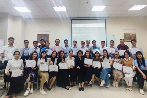 Participants receiving certificates of completion for the training workshop.