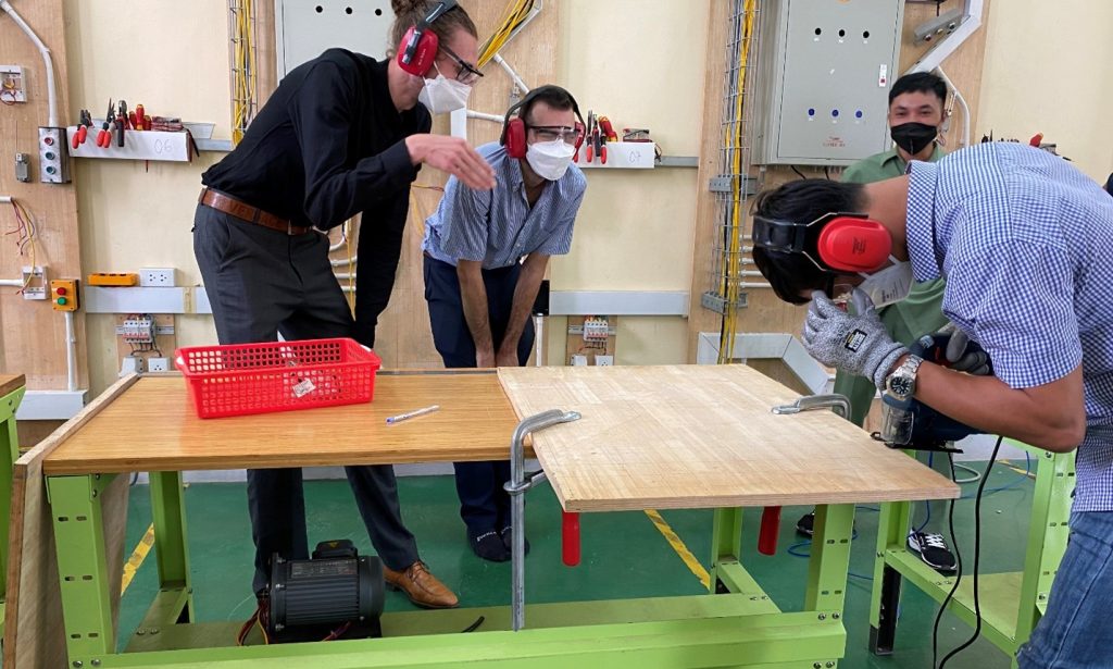 Mr Nguyen Hai Son was practicing the jig saw machine under supervisory of the trainers