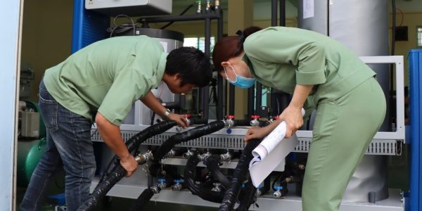 The teachers were installing the connection of modules in heating domestic water system
