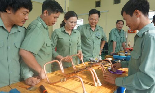 Trainer and teachers were testing processed copper pipes