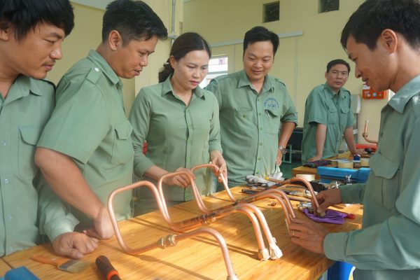 Trainer and teachers were testing processed copper pipes